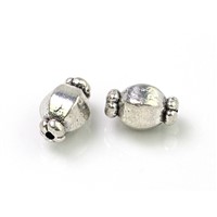 Kovové korálky 10 x 6 mm (otvor 1 mm)